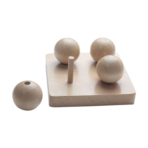 Four Balls On Small Pegs