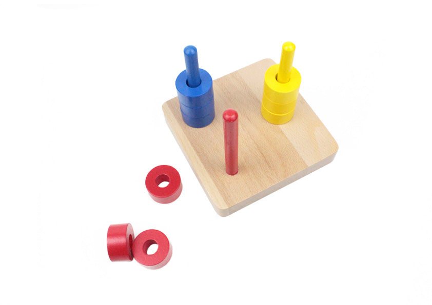 Colored Discs on Three Dowels – Pink Montessori